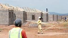 Workers are seen at a construction site at Protea Glen, a township of Johannesburg, South Africa, 19 March 2021. Reuters/Siphiwe Sibeko