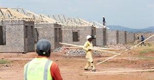 Workers are seen at a construction site at Protea Glen, a township of Johannesburg, South Africa, 19 March 2021. Reuters/Siphiwe Sibeko