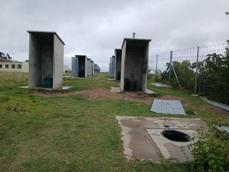 Toilets lack seats and doors.