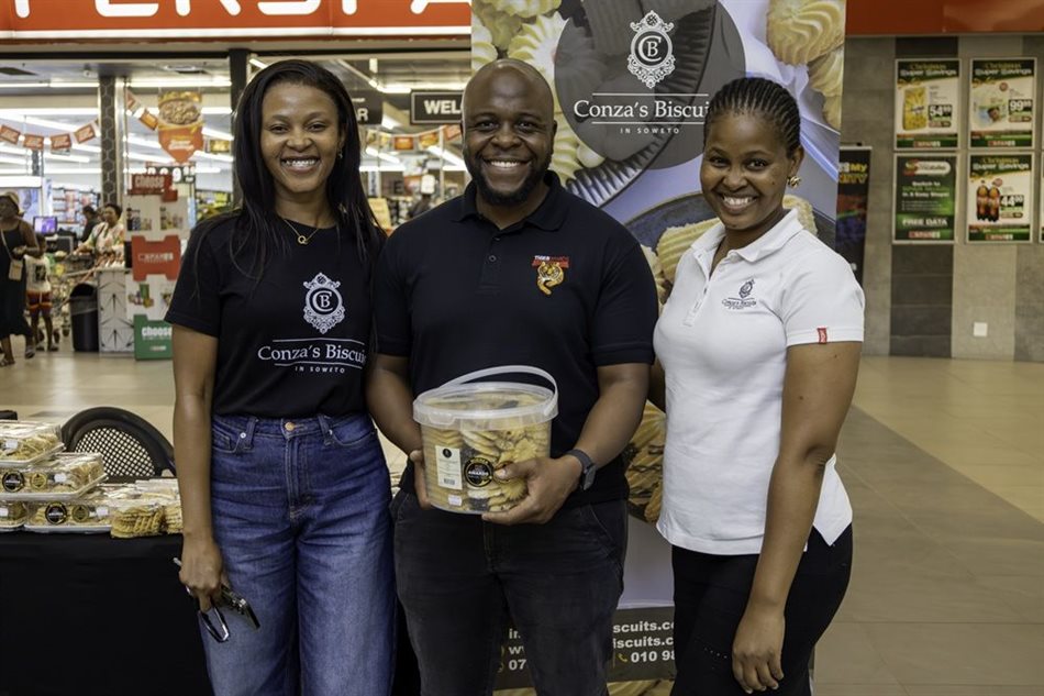 Rhulani (left) and Rirhandzu Chauke (far right), co-owners of Conza’s Biscuits, with Maanda Milubi, Director Enterprise and Supplier Development, Tiger Brands. Conza’s Biscuits is one of the township-based, women-owned businesses Tiger Brands has supported.
