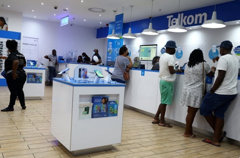 File photo: Customers are served at a branch of South Africa's mobile operator, Telkom, in Johannesburg, South Africa, 2 March 2022. Reuters/Siphiwe Sibeko/File Photo