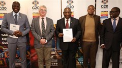 South African President Cyril Ramaphosa with SANEF member during a handover of M20 Johannesburg Declaration. From left to Right: Ronald Lamola, Minister of International Relations and Cooperation, William Bird, director of Moxii Africa, President Cyril Ramaphosa, Makhudu Sefara, chairperson of Sanef and Enoch Godongwana, Minister of Finance.