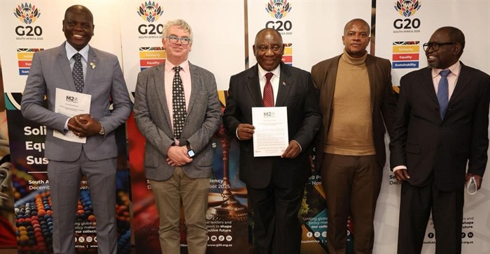 South African President Cyril Ramaphosa with SANEF member during a handover of M20 Johannesburg Declaration. From left to Right: Ronald Lamola, Minister of International Relations and Cooperation, William Bird, director of Moxii Africa, President Cyril Ramaphosa, Makhudu Sefara, chairperson of Sanef and Enoch Godongwana, Minister of Finance.
