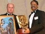 Multiple gold award winner Pragati Offset's Narendra Paruchuri from India accepts the 2004 Sappi Trading Printer of the Year award from Hugh Martin, Managing Director Sappi Trading