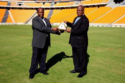 Adidas PR Manager Zobuzwe Ngobese hands over the Jo'bulani match ball to Mayor of Joburg Amos Masondo