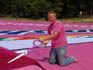 Vanish record breaker, Grant Macpherson, prepares to cut up the world's largest t-shirt in thousands of mini versions