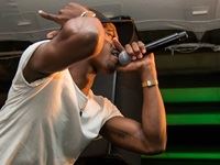 BlaQ-Slim gets the crowd moving as he revs up the energy of the evening.