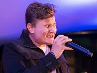 With an opera background, Keegan John Moore delivers a striking solo vocal performance