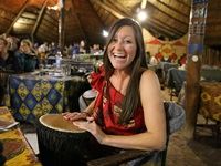 Image 1 - A guest enjoys the interactive drumming at The Boma - Dinner & Drum Show