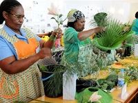 Mama Felicity gets a helping hand from Ezette with her masterpiece.