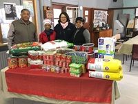 Cape Town Port Manager Mpumi Dweba (in red) with the leadership of the Douglas Murray Home Retreat and donations from port employees.