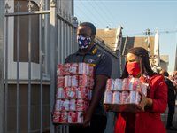DHL Stormers helps unpack food delivered by Pick n Pay at old age home